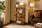 Teak rack with exactly 4 shelves against wall in angled view in luxurious family room